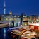 Boats in a river with the Berlin TV Tower in the distance